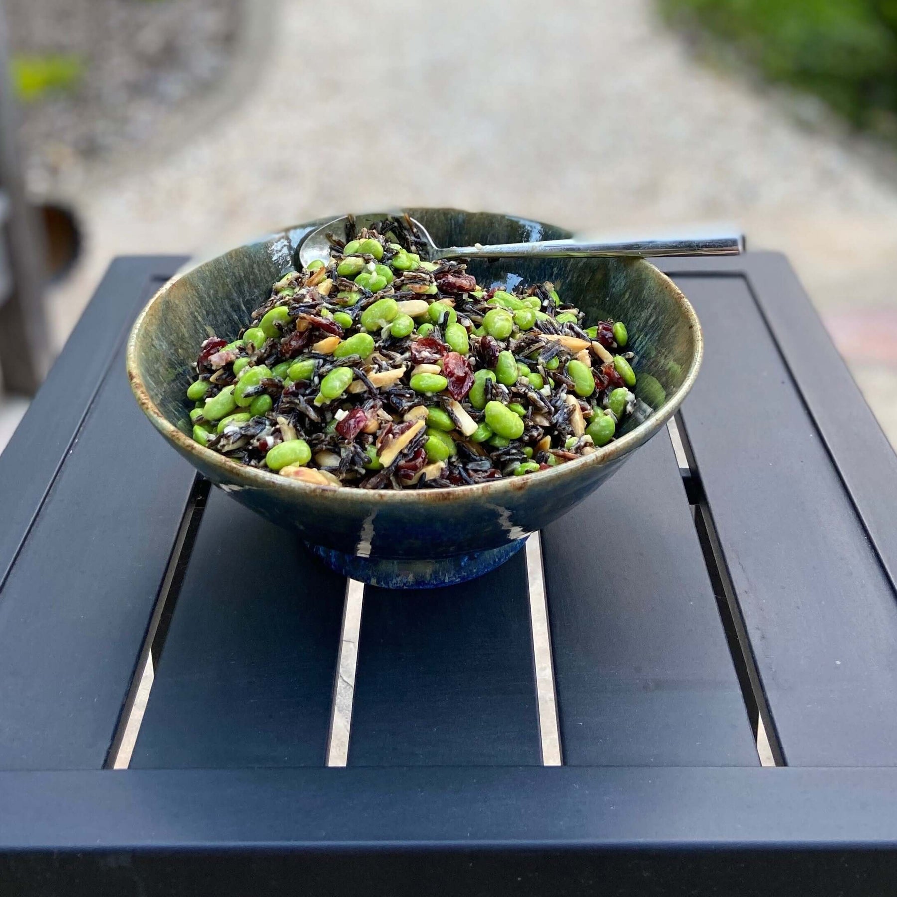 Wild Rice, Edamame and Cranberry Almond Salad Recipe served in a large bowl on a table.