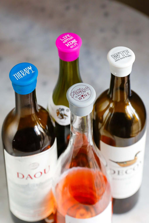 Therapy Silicone Wine Cap Set featuring colorful caps on wine bottles, perfect for sealing freshness and adding fun.