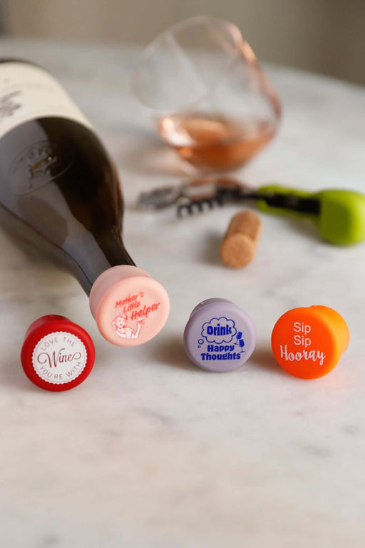 Playful CapaBunga Fun Wine Caps Set with four colorful silicone caps for sealing wine bottles effectively.