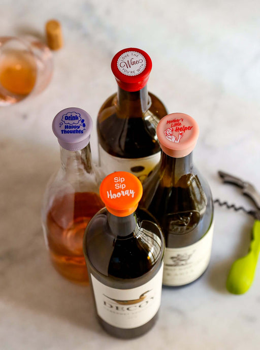 Colorful CapaBunga Fun Wine Caps on wine bottles, creating a playful and airtight seal for fresh storage.