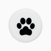 Silicone wine cap featuring a black paw print design on a white background.