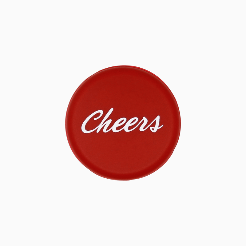 Red silicone wine cap with the word 'Cheers' in white, perfect for celebrating and keeping wine fresh.