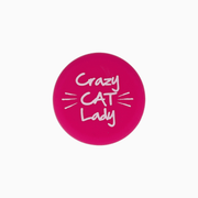 Pink silicone wine cap with the phrase 'Crazy CAT Lady' printed in white.