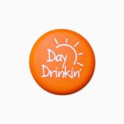 Orange silicone wine cap with the text 'Day Drinkin'' and a sun design, perfect for casual wine lovers.