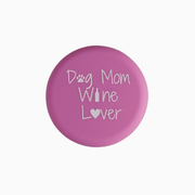 Pink silicone wine cap with text 'Dog Mom Wine Lover' featuring paw print and heart design.