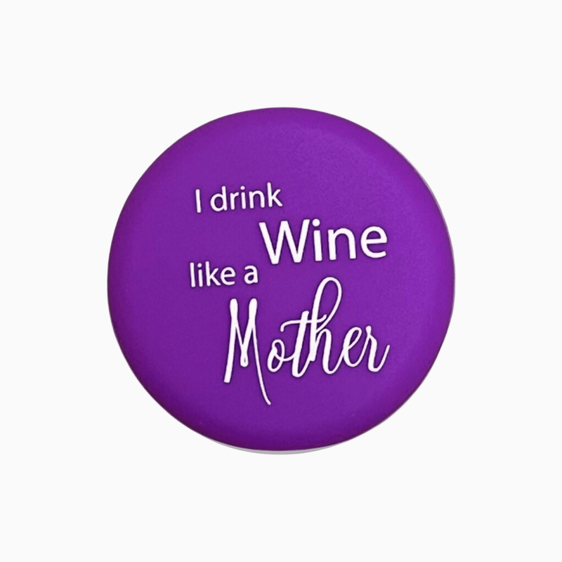 Purple silicone wine cap with the phrase 'I drink like a Mother' in white lettering.