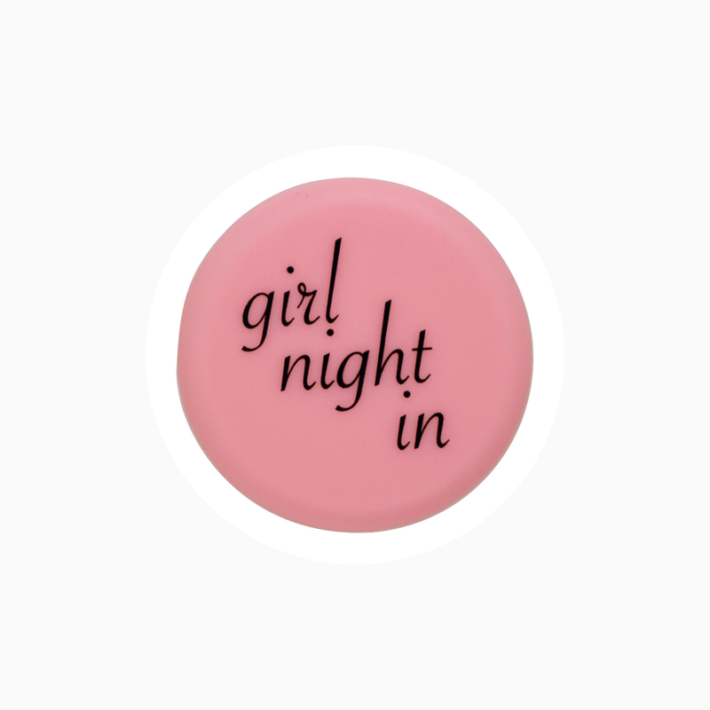 Pink silicone wine cap design with the text 'girl night in' for wine lovers.