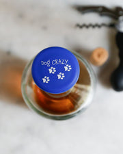 Dog Crazy silicone wine cap with paw print design, perfect for proud dog owners.