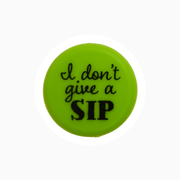 Bright green silicone wine cap featuring the phrase 'I don't give a SIP' for fun wine storage.