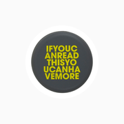 Black silicone wine cap with yellow text saying "IFYOUCANREADTHISYOUCANHAVEMORE".