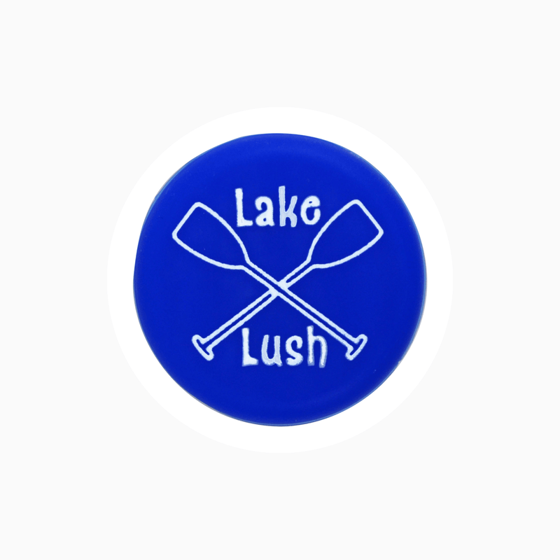 Lake Lush silicone wine cap featuring crossed paddles design in vibrant blue.