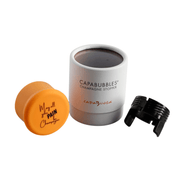 CapaBubbles Champagne Stopper in white with orange cap reading 'May All Your Pain Be Champagne' and black collar to attach around the neck of the bottle