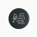 Silicone wine cap with the quote 'Let's drink wine & judge people' and a wine glass illustration.