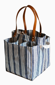 Striped market tote with pockets, stylish design and sturdy handles for effortless shopping.