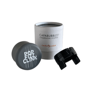 CapaBubbles Champagne Stopper featuring 'Pop Fizz Clink' design for preserving sparkling wine.