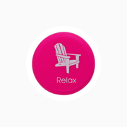 Pink silicone wine cap featuring an illustrated chair and the word 'Relax'.