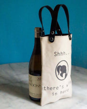 Shh There Is Wine Canvas Wine Tote with a bottle of Chardonnay, featuring black vegan leather handles.