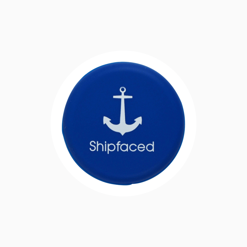 Blue silicone wine cap with anchor design and "Shipfaced" text, ideal for sealing bottles.