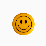 Yellow silicone wine cap with a smiling face design, perfect for adding fun to wine storage.