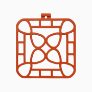 Interlocking silicone trivet in orange color, designed for heat-resistance and stylish serving.