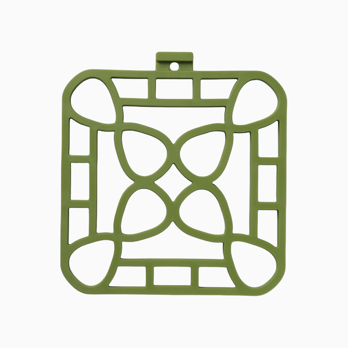 Interlocking silicone trivet in green color featuring a unique modular design for heat resistance and style.