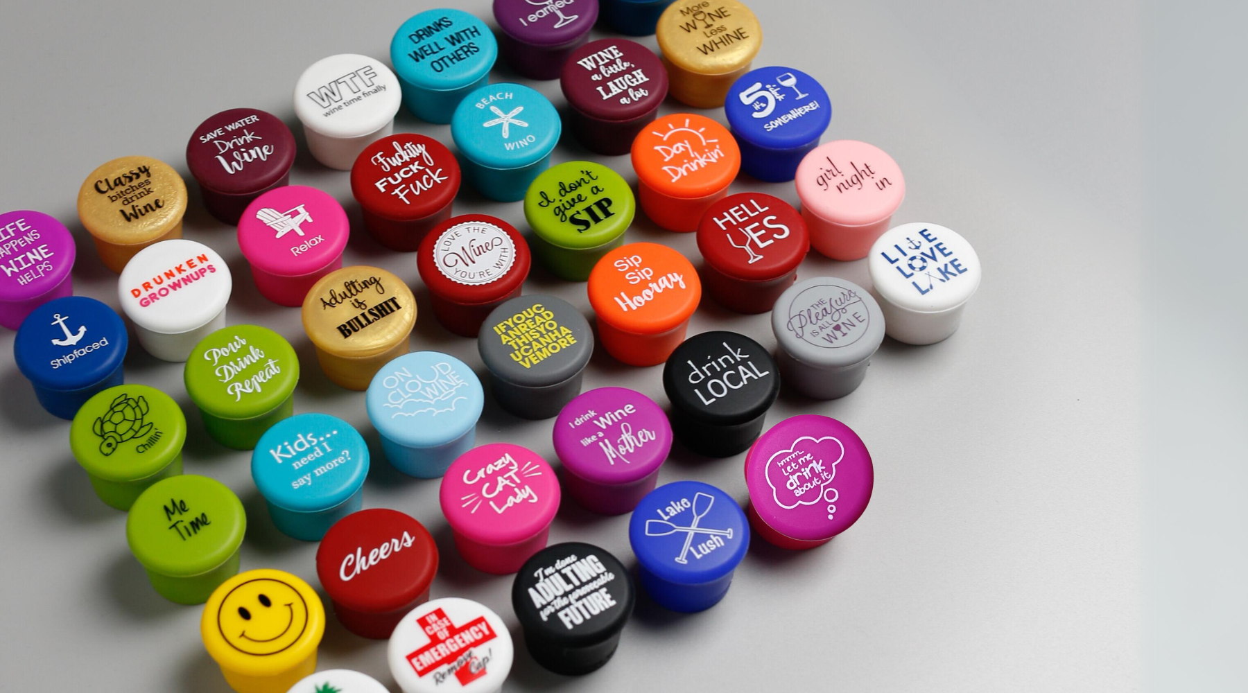  image of CapaBunga's top 40 wine cap designs, featuring a variety of colorful silicone caps designed to securely seal wine bottles and preserve freshness