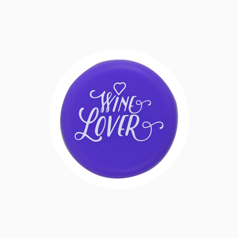 Purple silicone wine cap with 'Wine Lover' text design for wine bottle sealing.