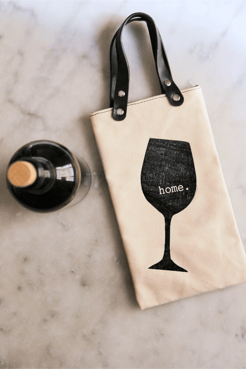 Home Canvas Wine Tote with vegan leather handles and glass design, ideal for hosting and gifting.