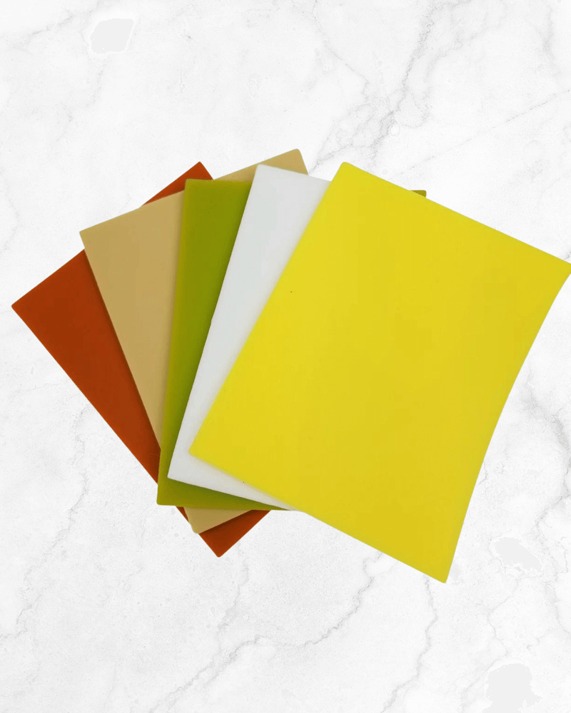Colorful Cheese Vault Dividers in various shades including yellow, green, orange, beige, and white on a marble background.